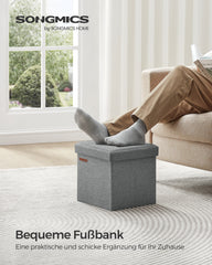SONGMICS LSF028G02 light-grey ottoman used as a footrest beside a sofa