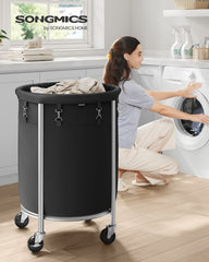 SONGMICS URLS002B01 laundry basket beside a washing machine