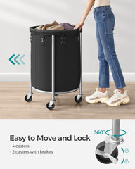 SONGMICS URLS002B01 laundry basket showing wheels and movement